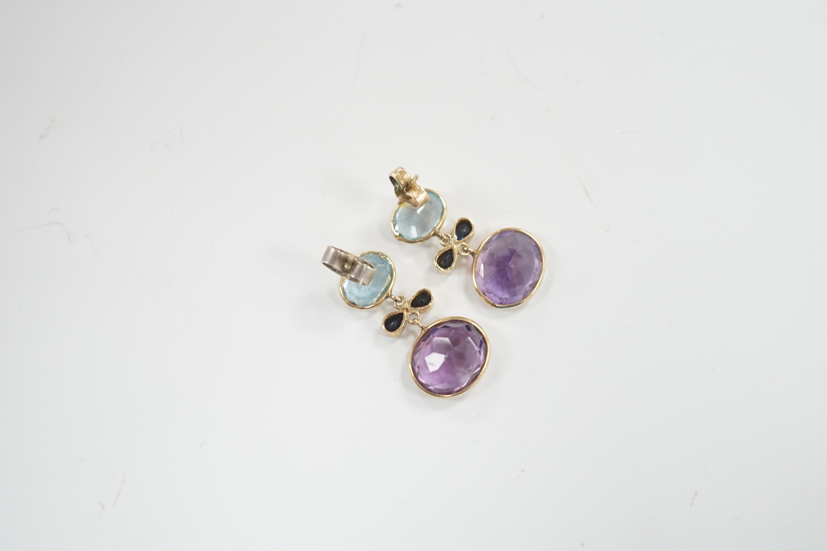 A pair of yellow metal and four stone, blue topaz, amethyst and sapphire? set drop earrings, 25mm, gross weight 4.7 grams.